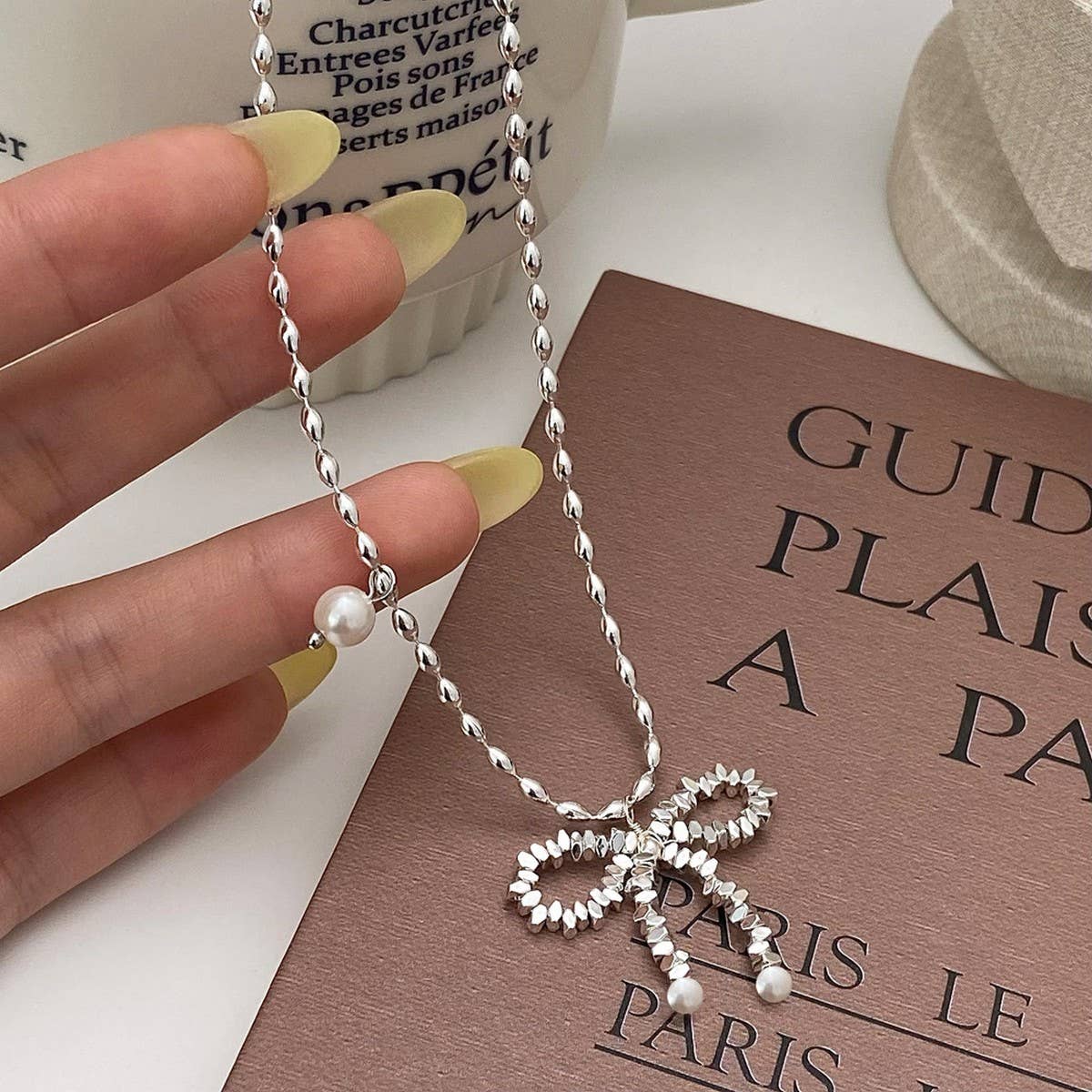 WOMEN'S PEARL AND SILVER BOW PENDANT NECKLACE