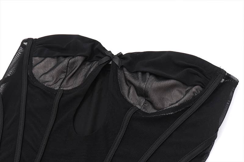 A corset, sheer, short, tight, cinched jumpsuit