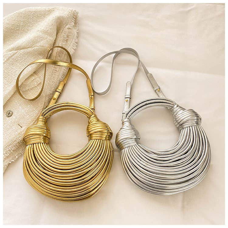 Metallic color striped appearance glossy handbag