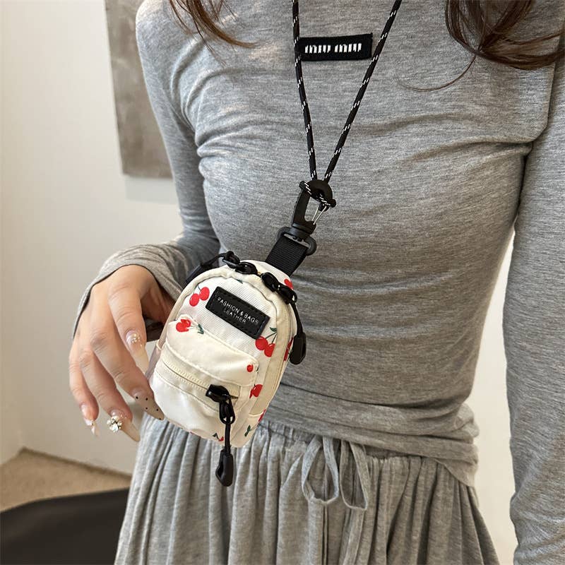 Printed mini lipstick headphones and small bag