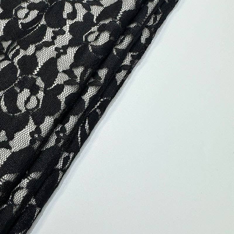 A strappy deep V lace see-through dress