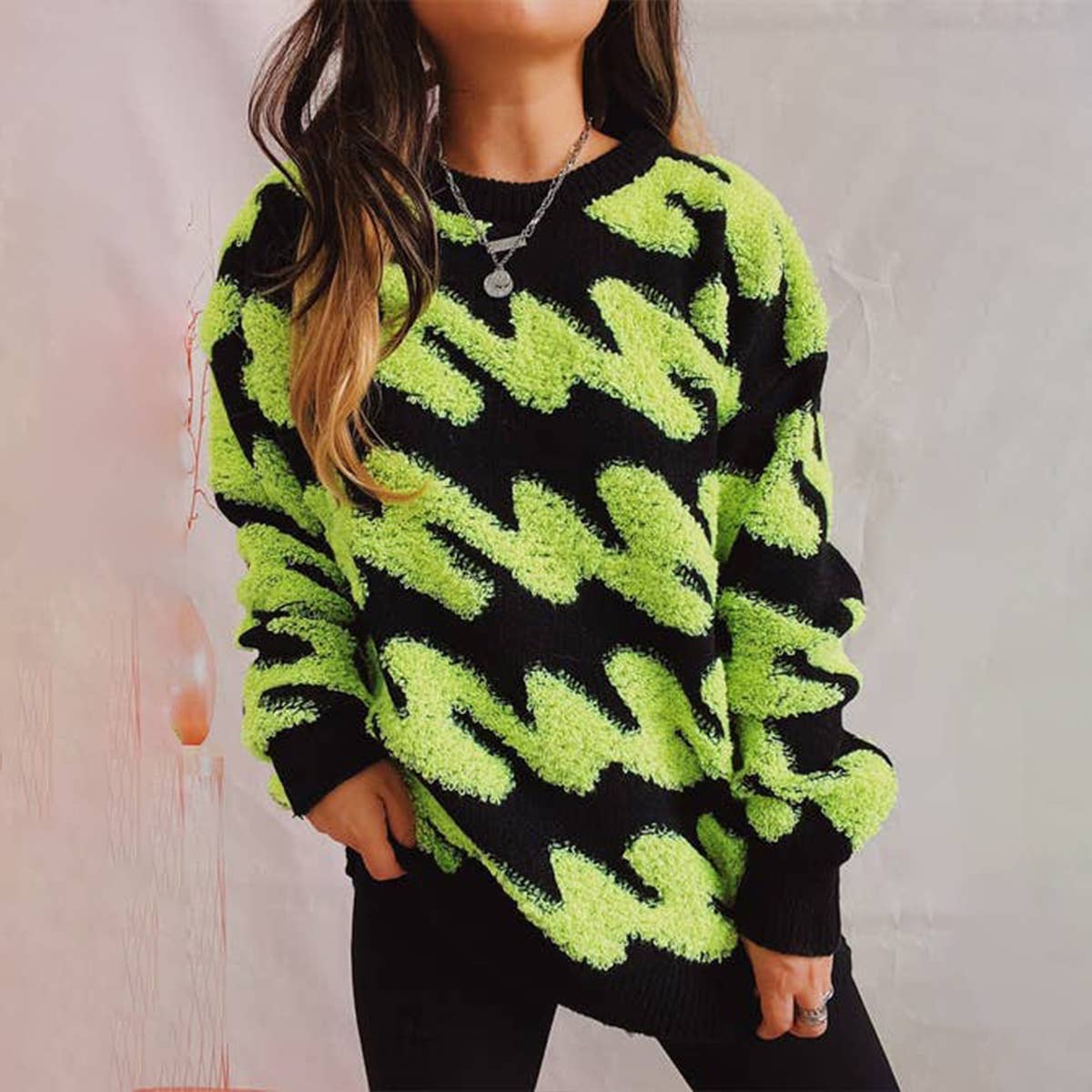 Long sleeve knit sweater with wavy stripes flocking
