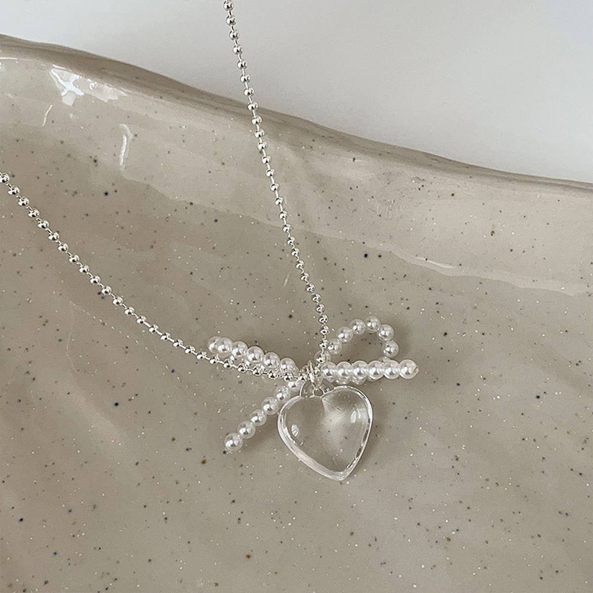 FASHION TRANSPARENT HEART PENDANT BOW NECKLACE_CWAJE3073