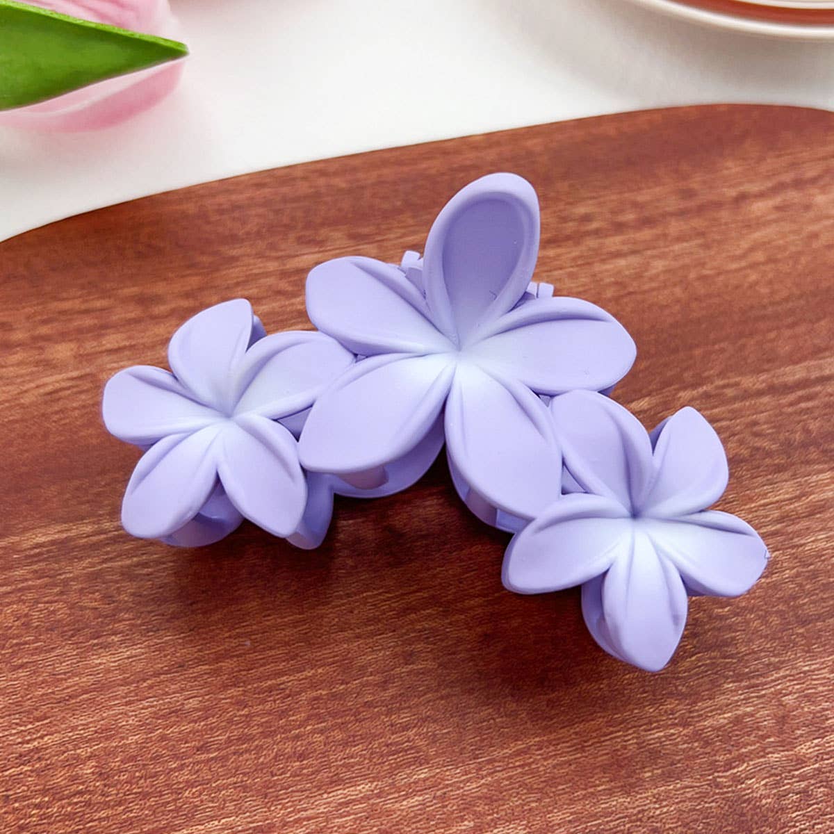 Candy-colored plastic hair clips with flowers