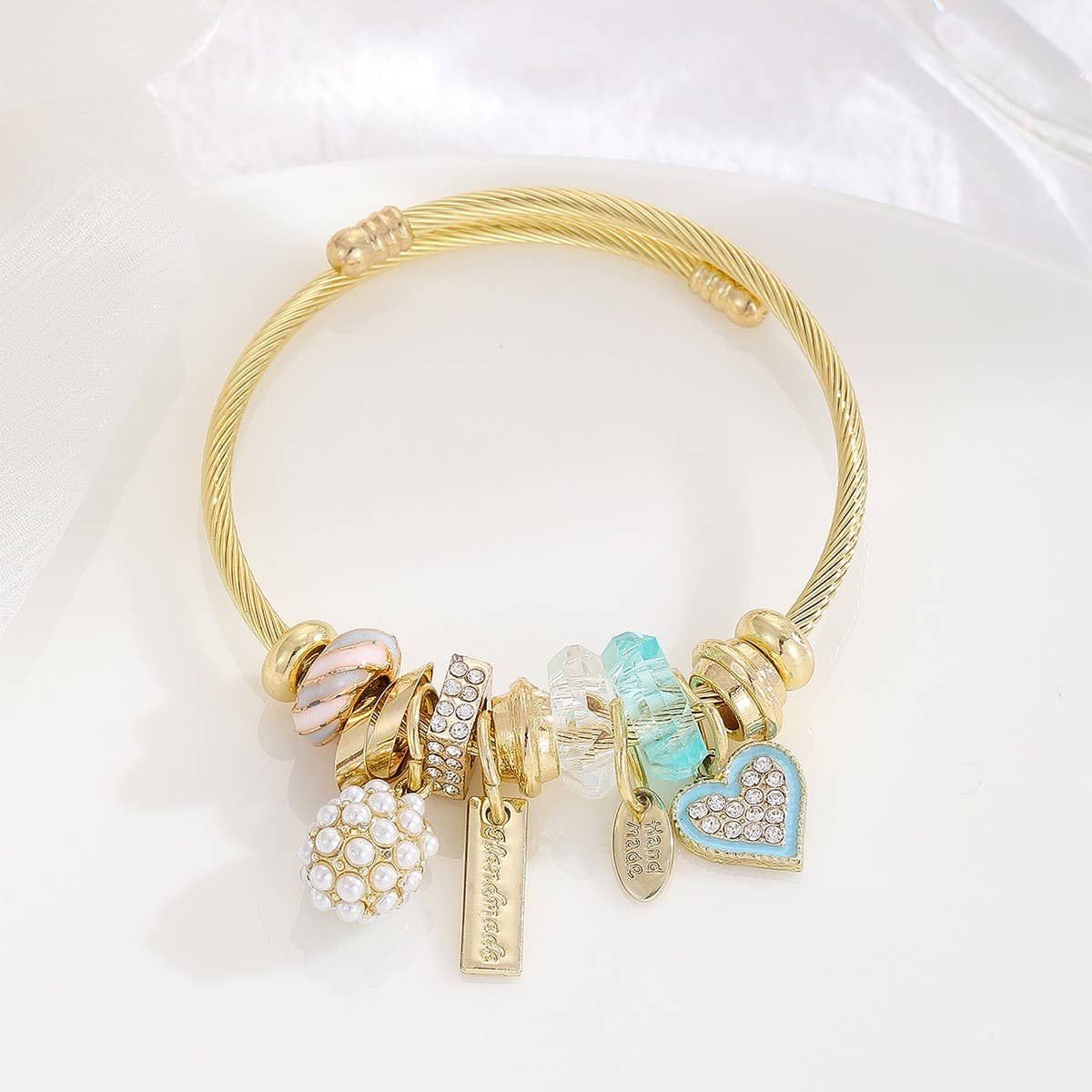 Gold Bracelet with Tree, Heart & Tail Charms