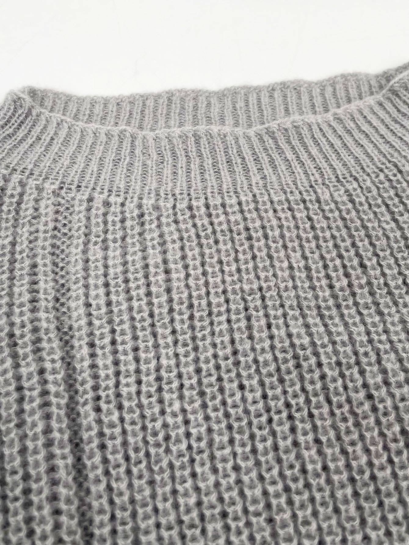 Laid-back style distressed frayed sweater