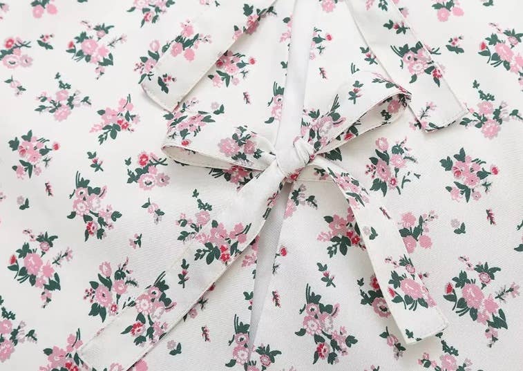 SHORT FLORAL PRINT STRAP VEST