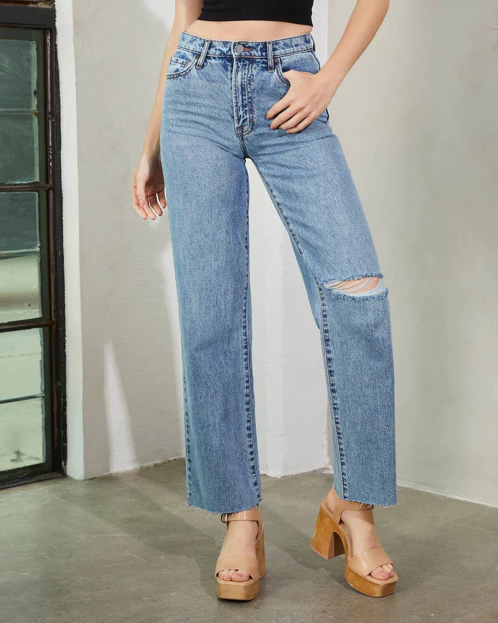 High-waisted washed fashionable ripped jeans