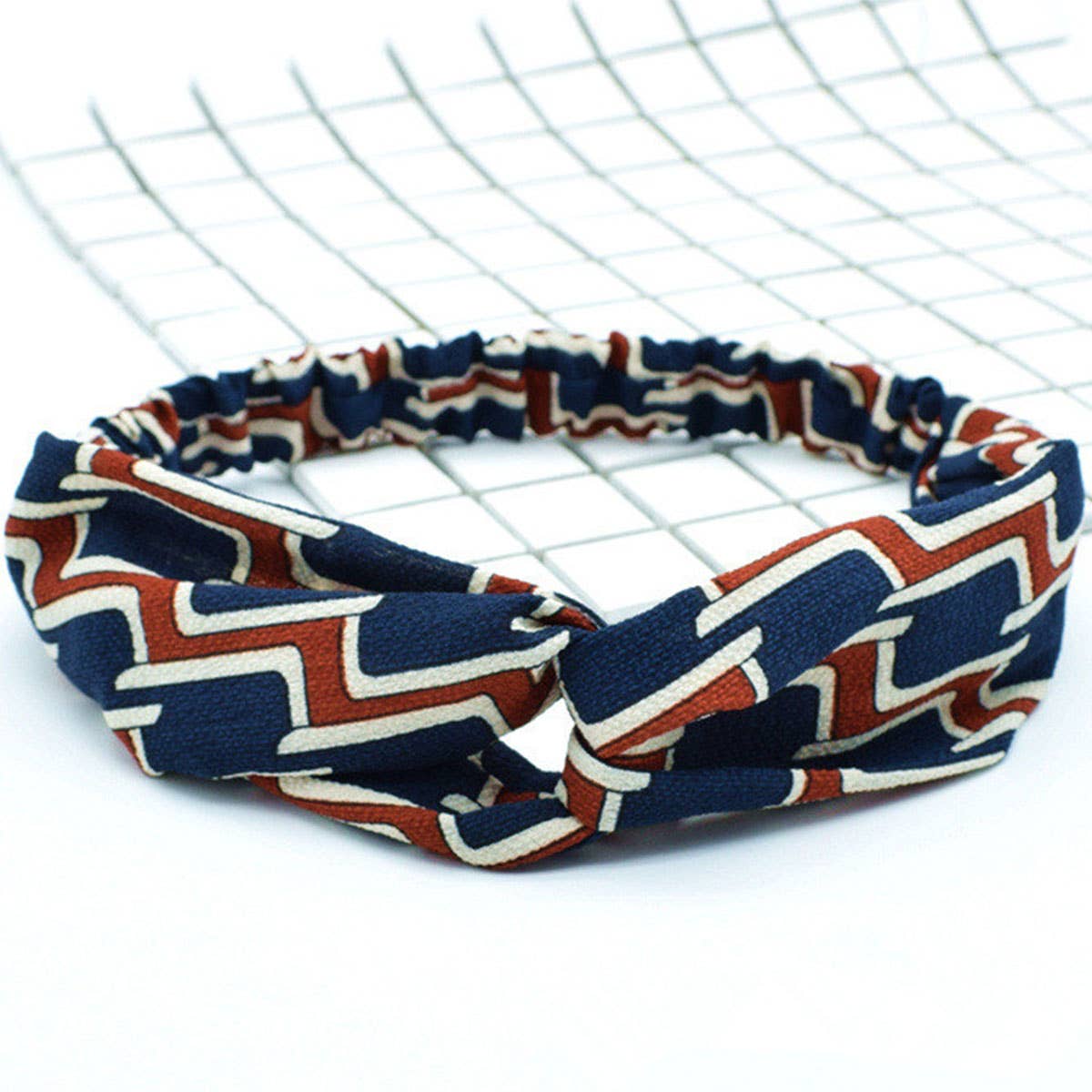 Silk hair band with interlaced patterns