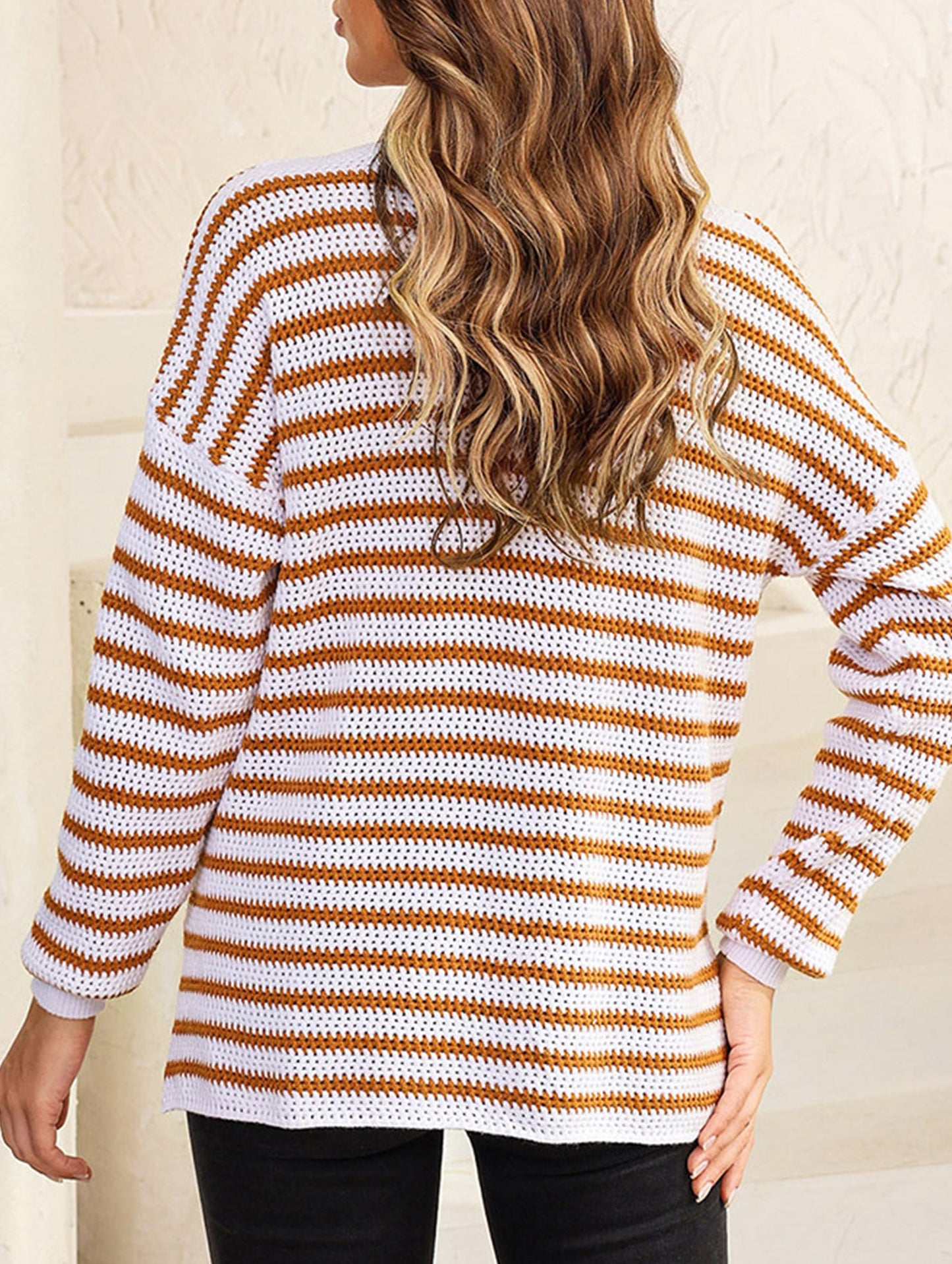 Loose-fitting turtleneck sweater with stripes
