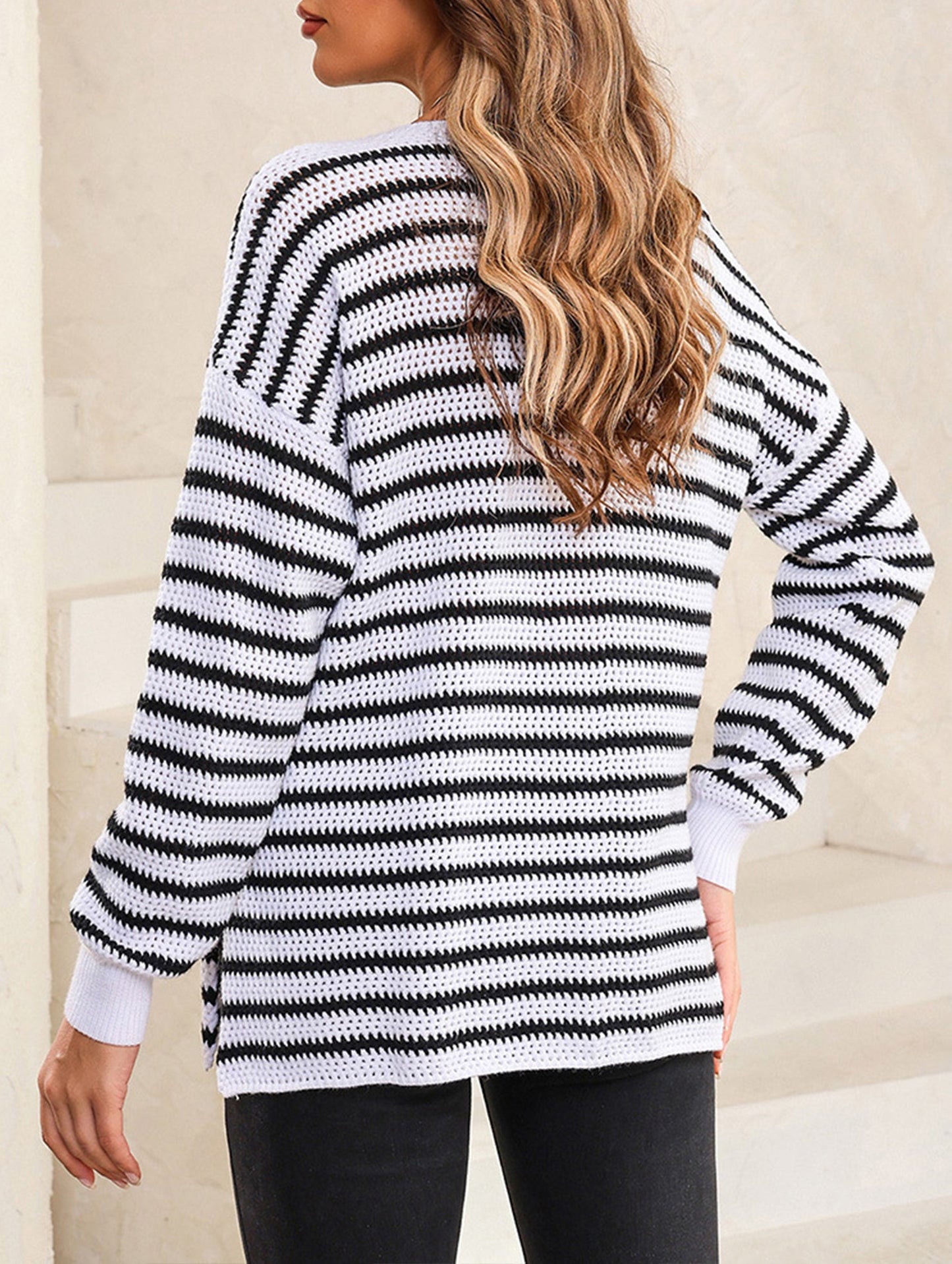 Loose-fitting turtleneck sweater with stripes