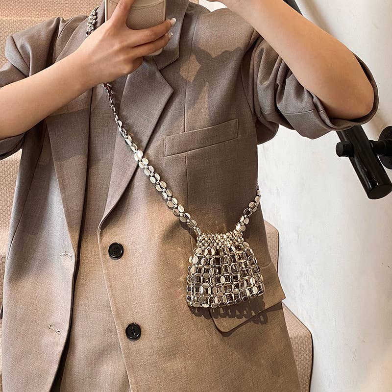 Fashionable hollowed-out glossy crossbody bag