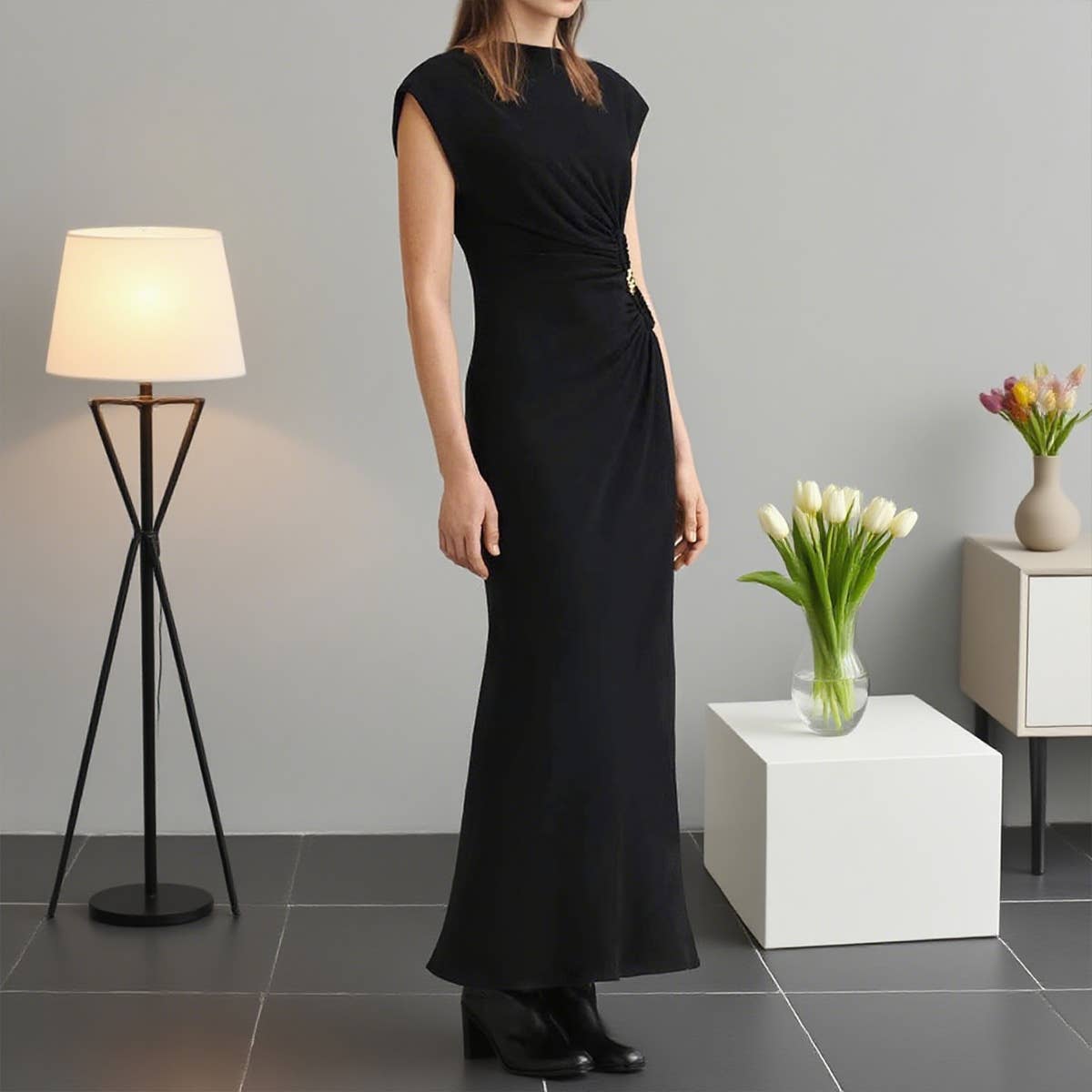 Simple pleated buttons adorn the dress