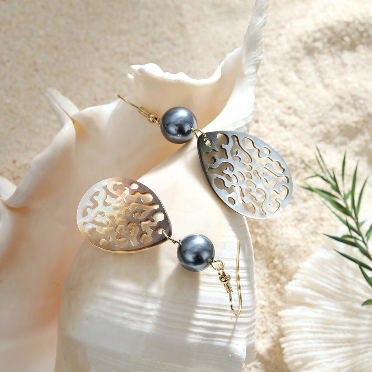 CREATIVE HOLLOW CARVED NATURAL SHELL EARRINGS