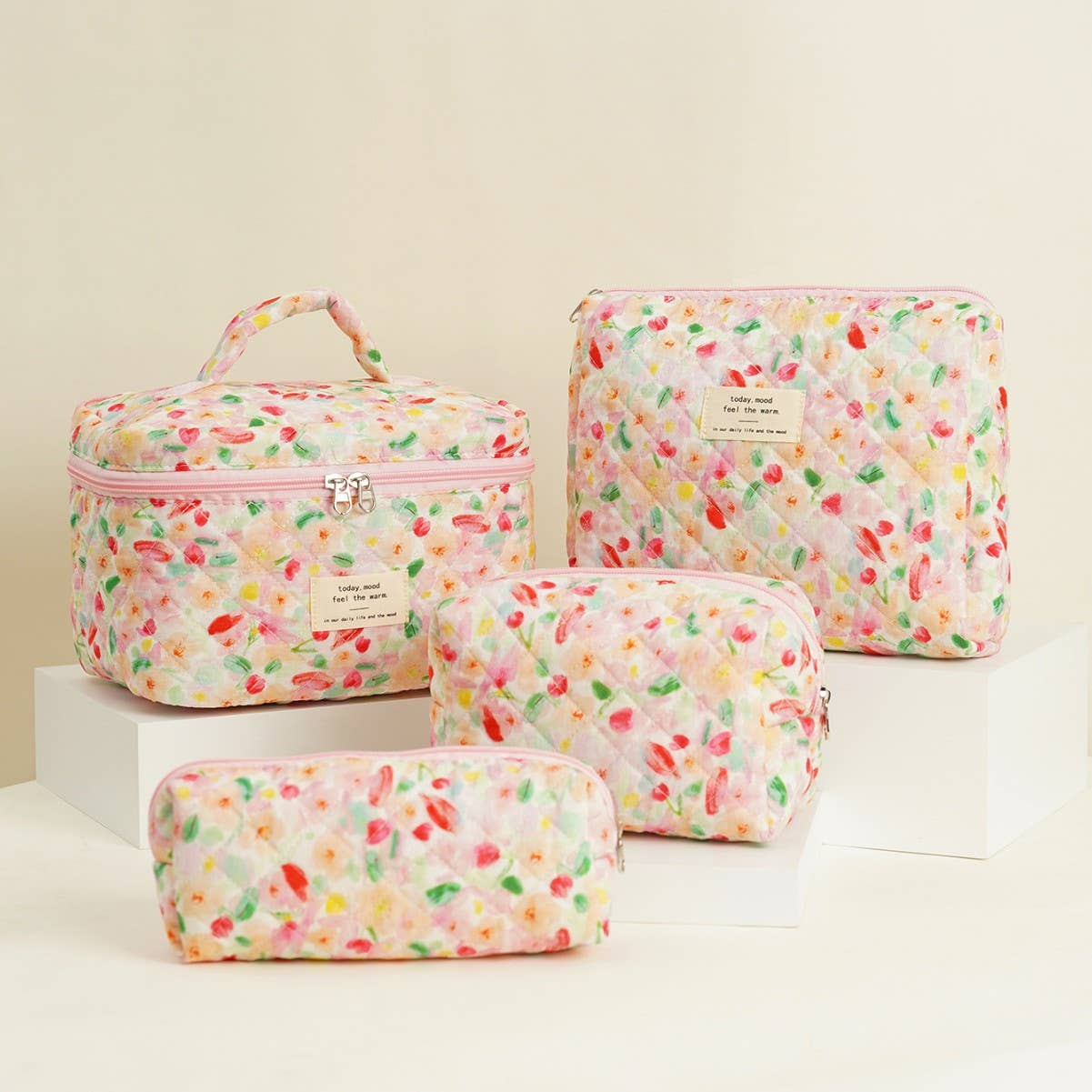 Four-piece set of quilted floral makeup bags