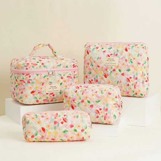 Four-piece set of quilted floral makeup bags