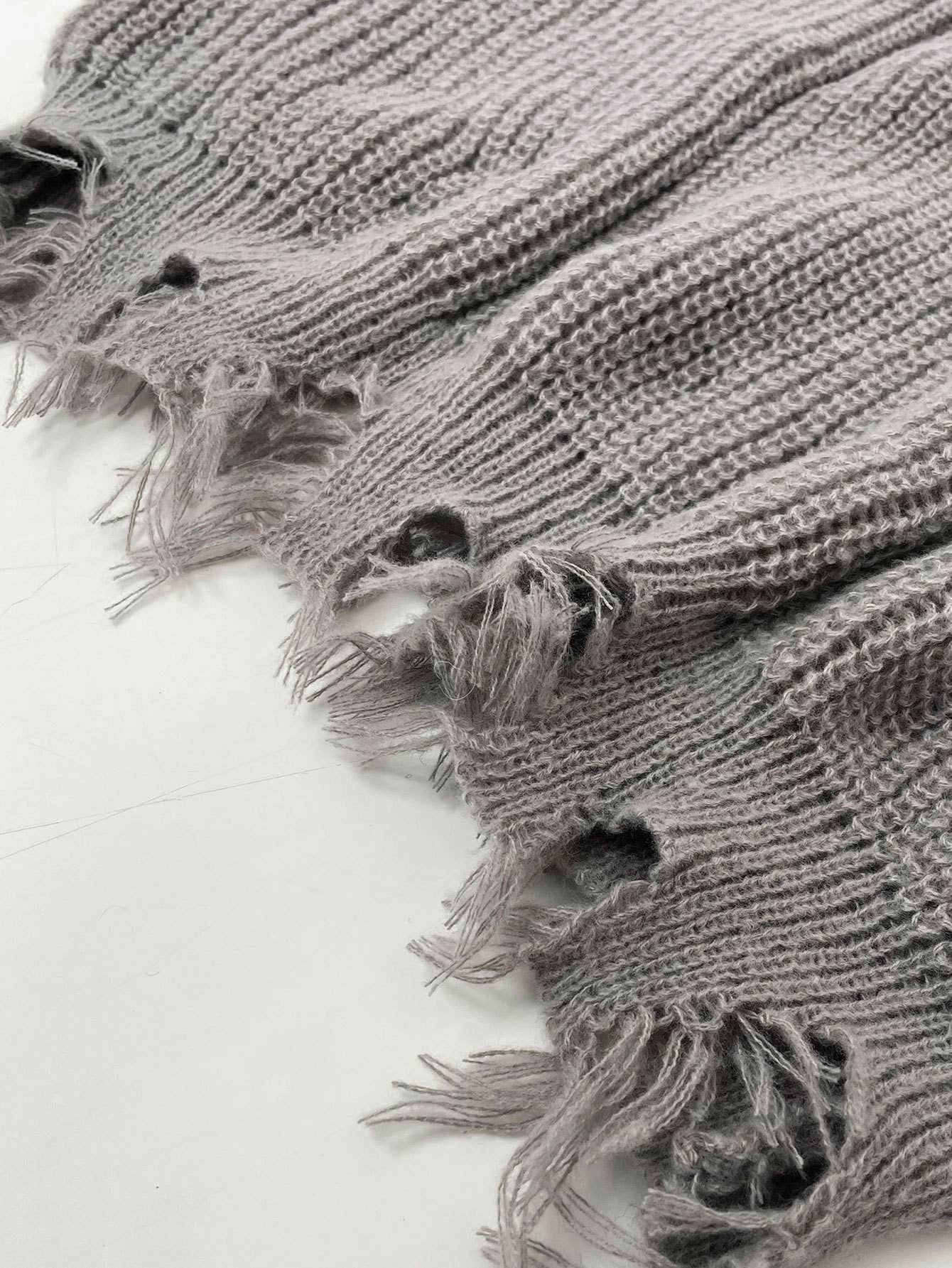 Laid-back style distressed frayed sweater