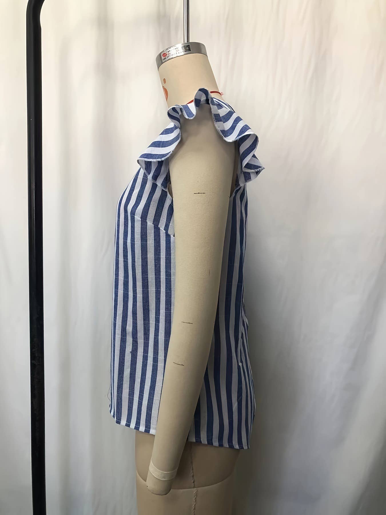 V-neck with back buttons flying sleeveless top