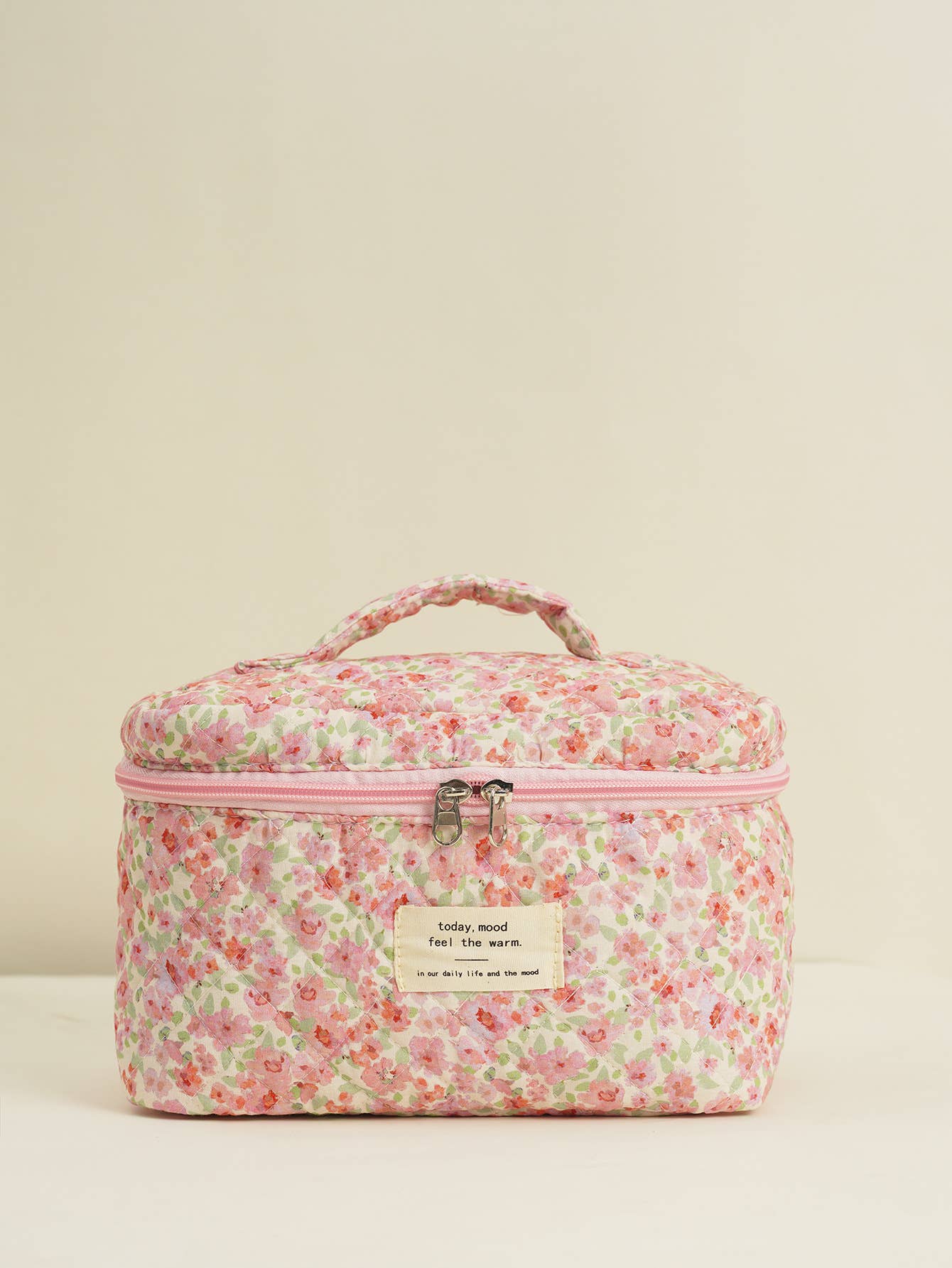 Four-piece set of quilted floral makeup bags