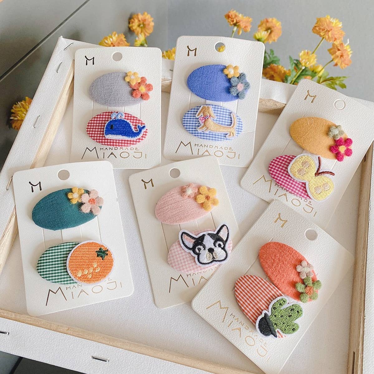 CHILDREN'S OVAL EMBROIDERED PATCH HAIRPIN