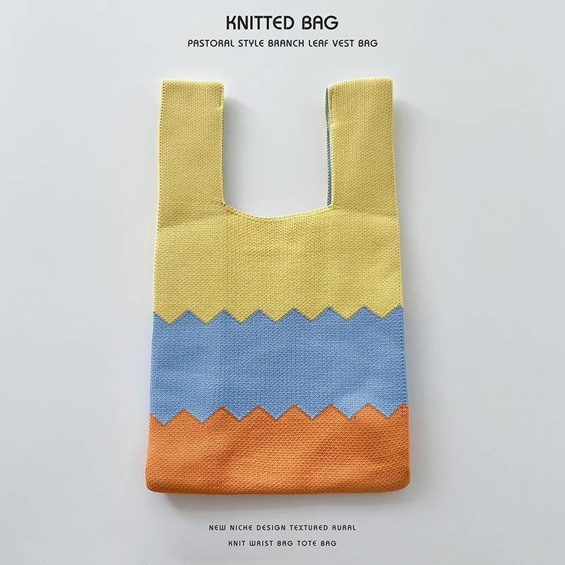 Heart-shaped color-blocked knitted handbag