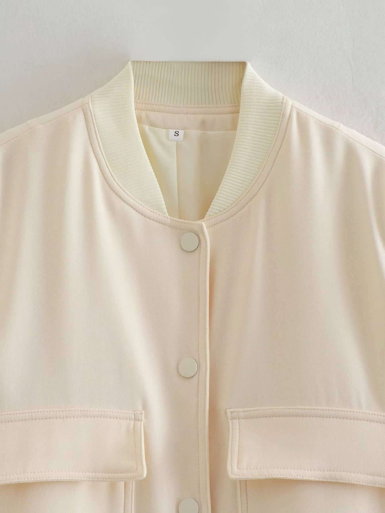 SOLID SHORT JACKET WITH LARGE POCKET STAND COLLAR