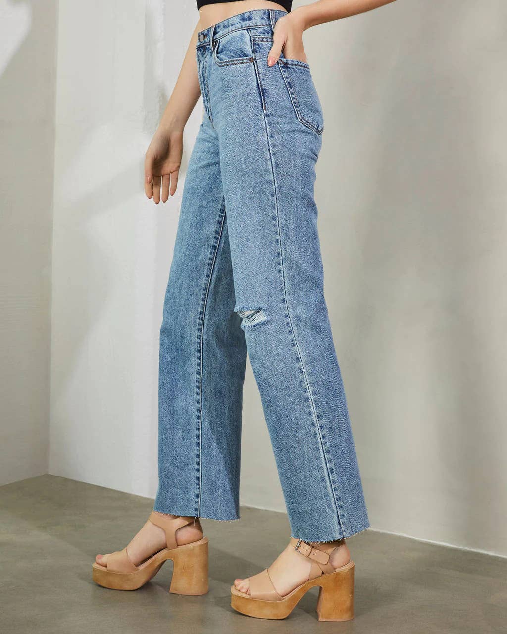 High-waisted washed fashionable ripped jeans