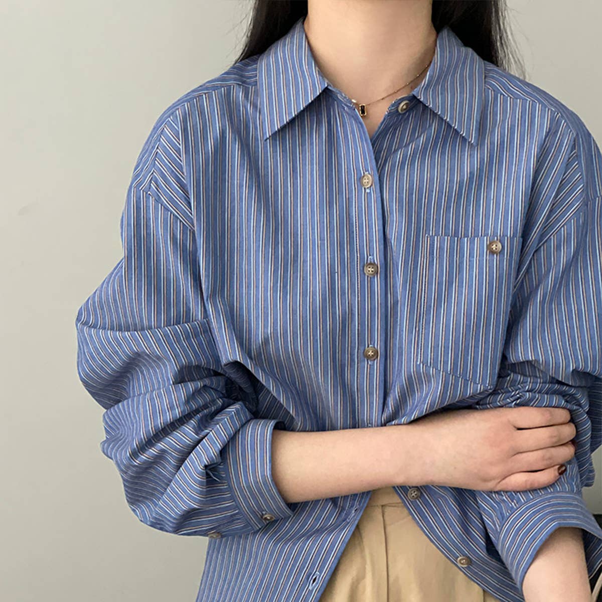 Wear a wide, slim, long-sleeved shirt