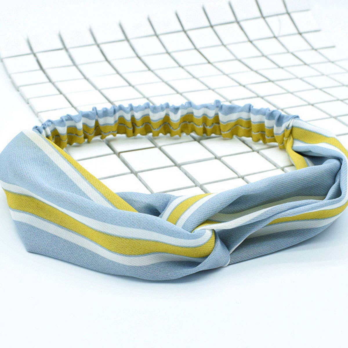 Silk hair band with interlaced patterns