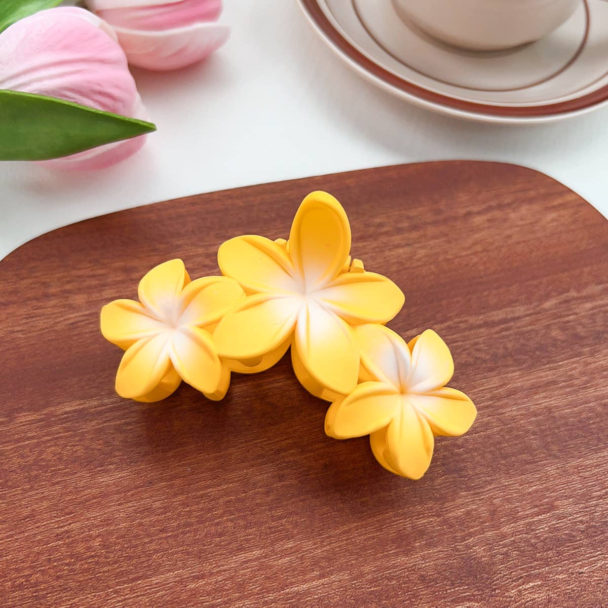 Candy-colored plastic hair clips with flowers