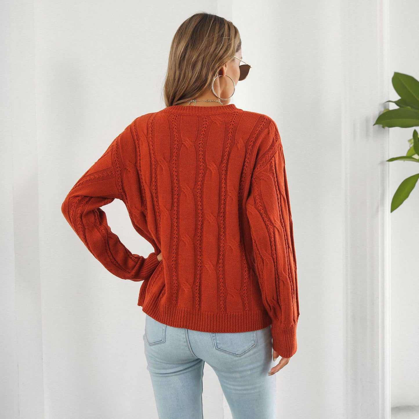 Twist hollowed loose long-sleeved sweater