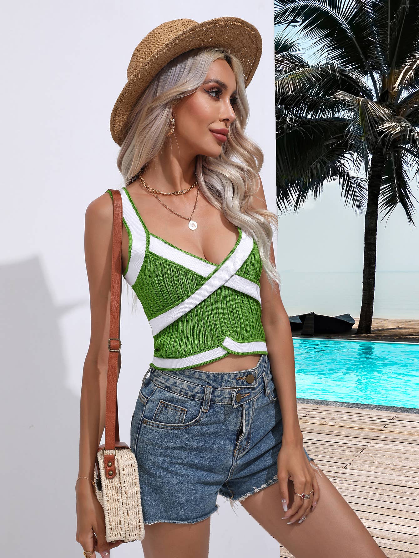 SLEEVELESS V-NECK SWEATER WITH CROSS HALTER