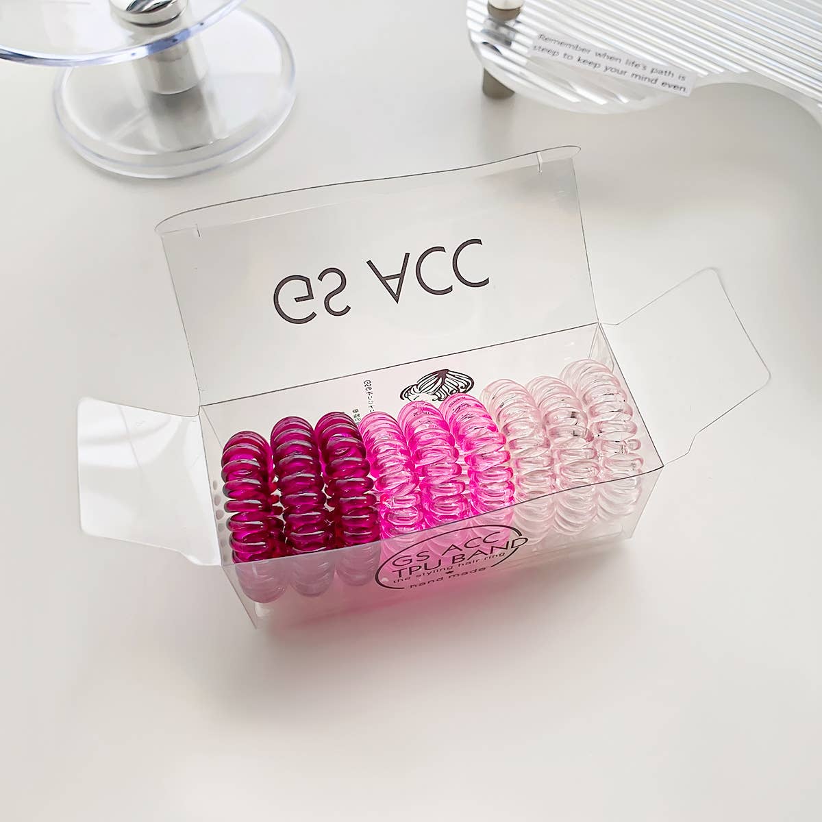 Nine candy-colored rubber bands for hair ties