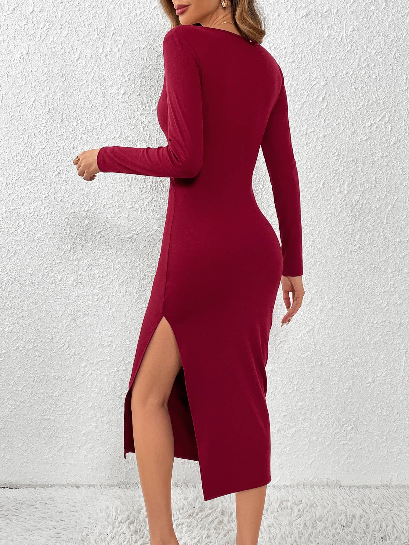 HOLLOWED OUT AT THE WAIST AND SPLIT AT THE SIDE