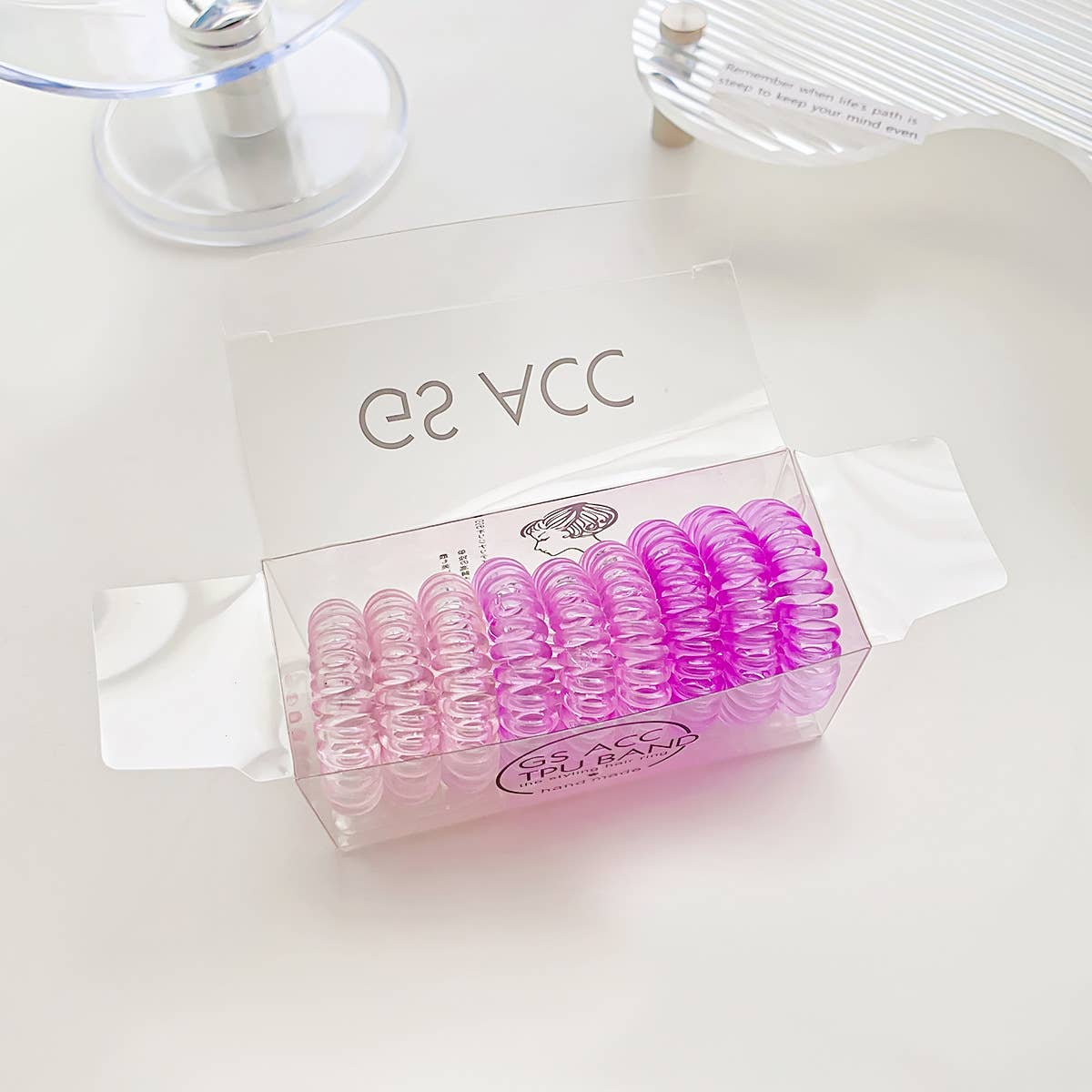 Nine candy-colored rubber bands for hair ties