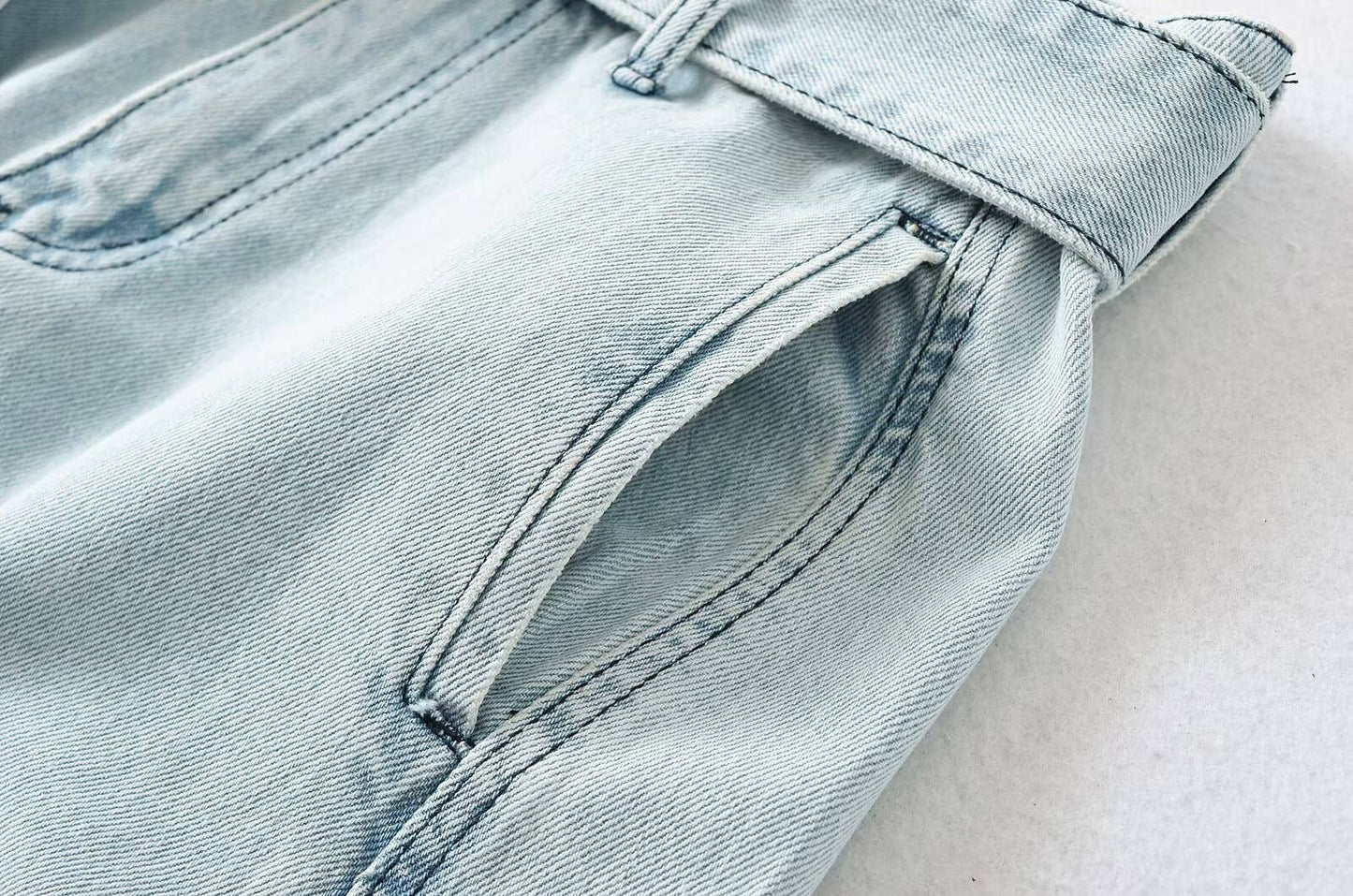 High street girls pair wide-leg jeans with belts