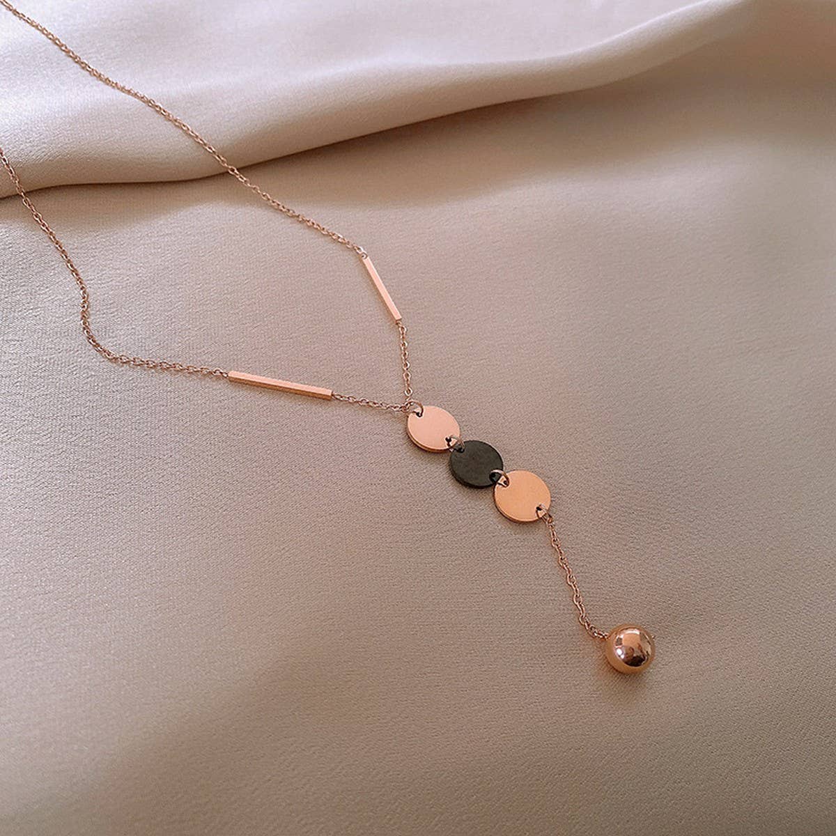 GEOMETRIC SEQUIN TASSEL NECKLACE