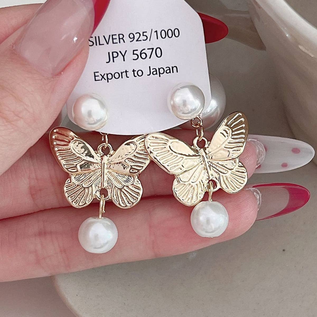 PEARL BUTTERFLY TASSEL EARRINGS_CWAJE2037