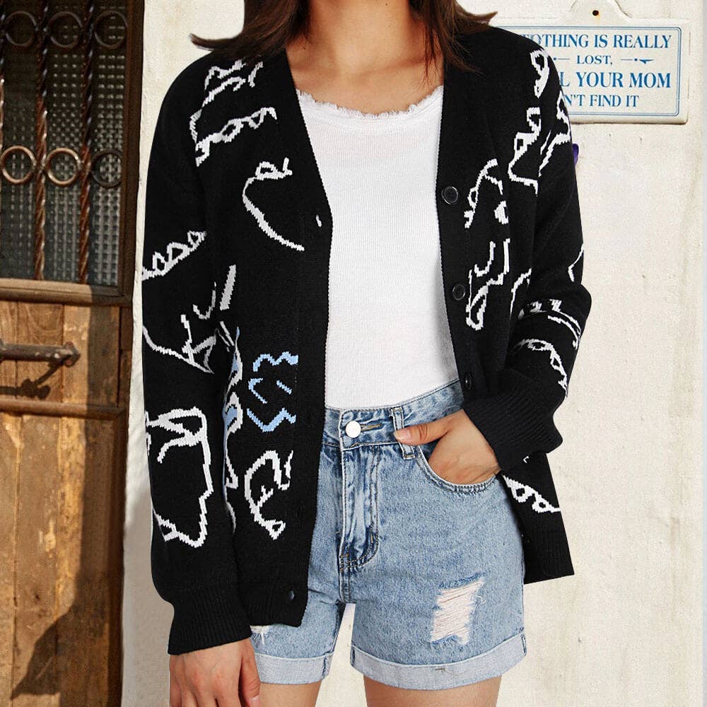 THE JACKET IS A LOOSE CARTOON DINOSAUR CARDIGAN