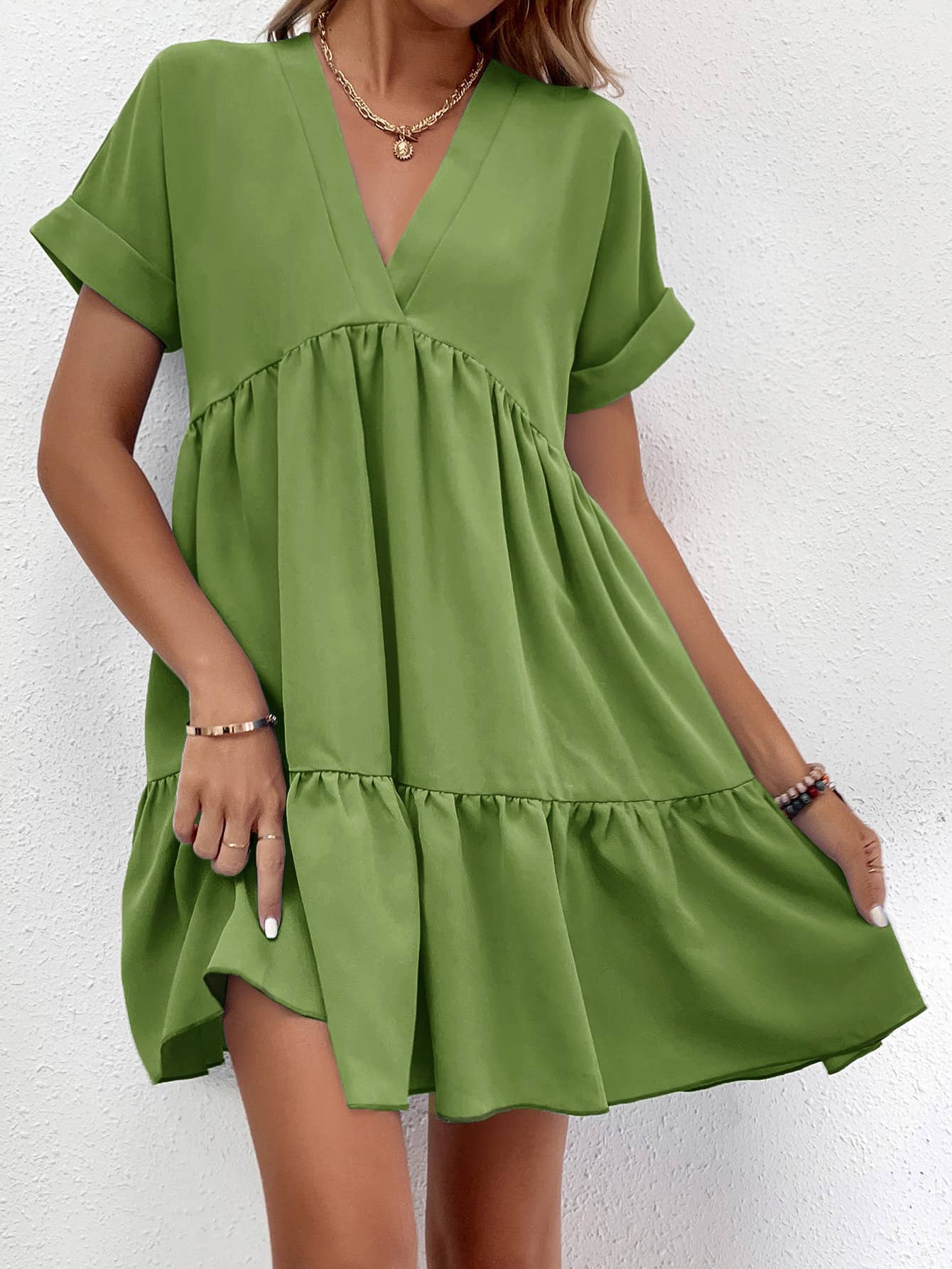 A casual, loose V-neck, large-hem short dress