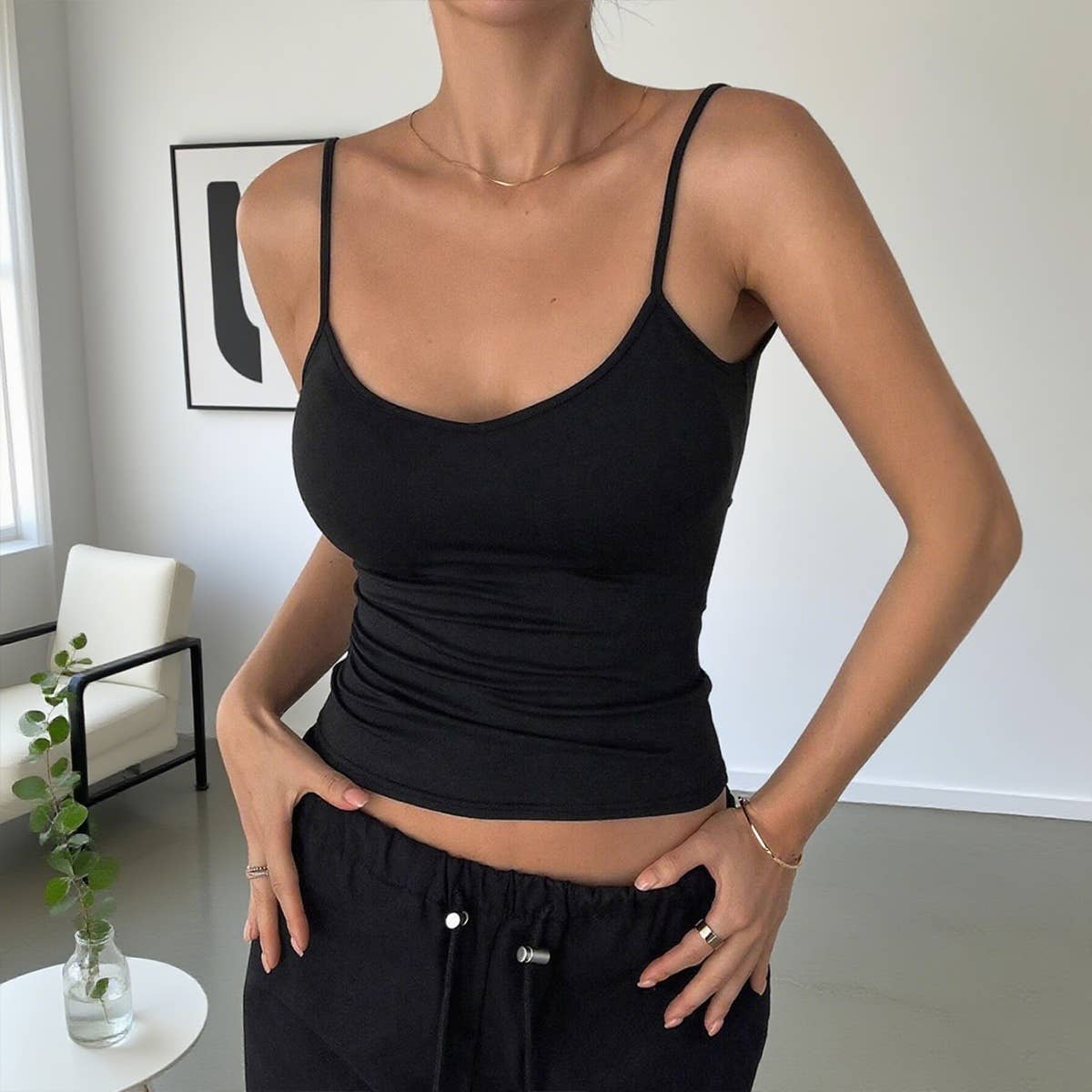 Solid-color backless, form-fitting halter top