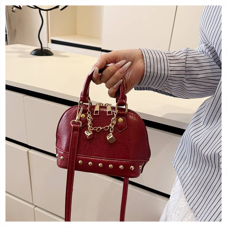 Fashionable riveted single-shoulder bag