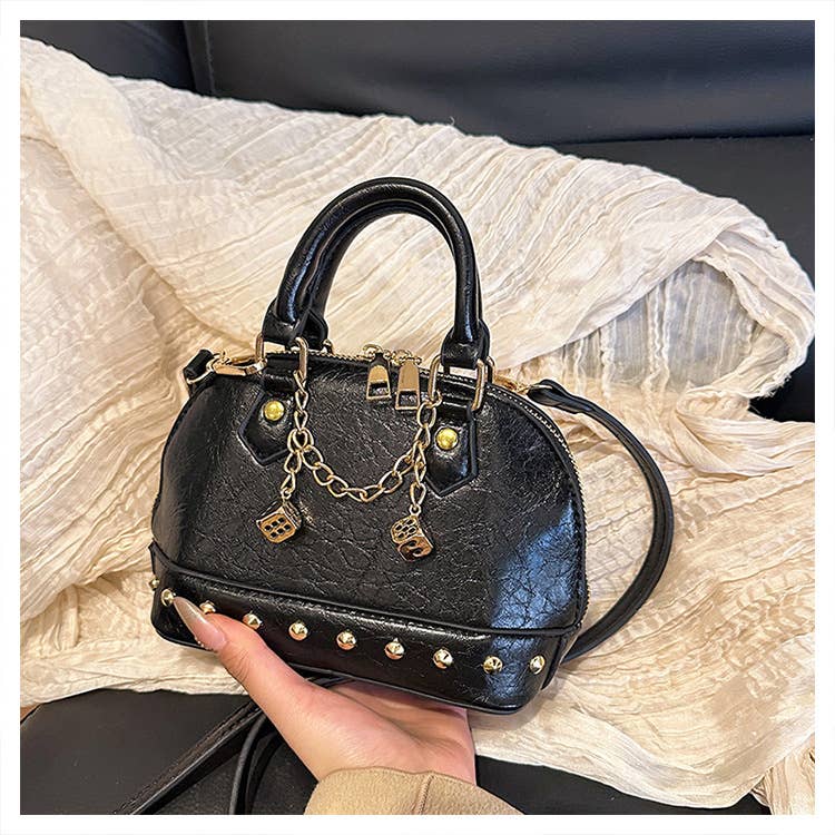 Fashionable riveted single-shoulder bag