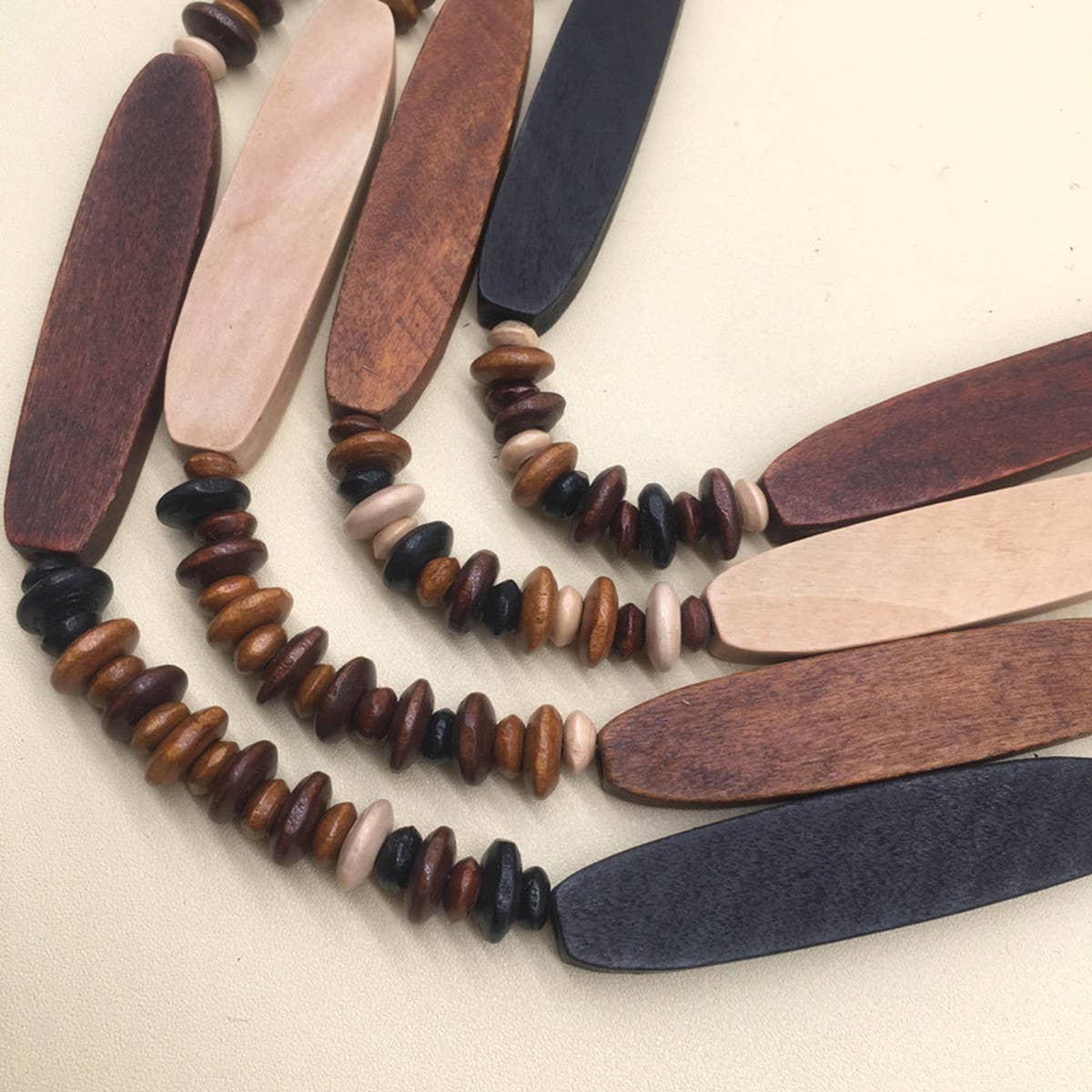 MULTI-LAYERED GEOMETRIC WOODEN BEAD NECKLACE