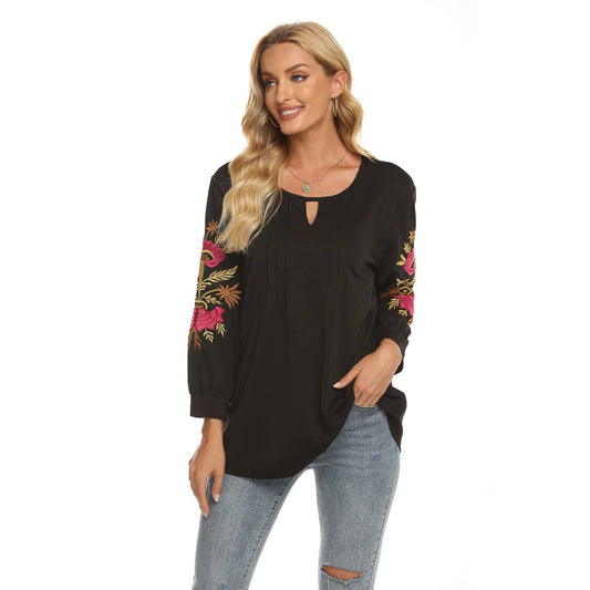 Three-dimensional flower-embroidered top