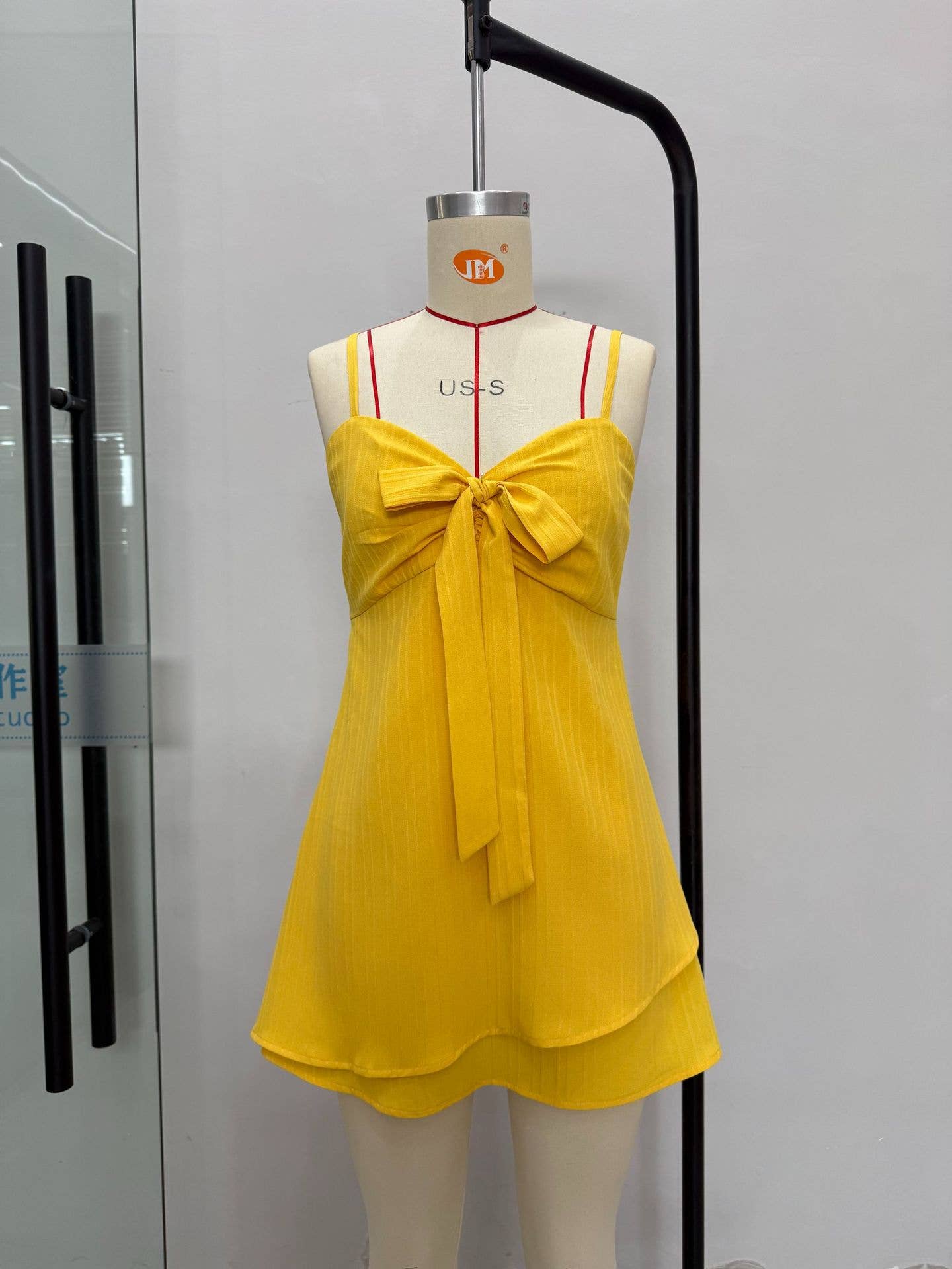 Solid color holiday dress with a bow on the chest