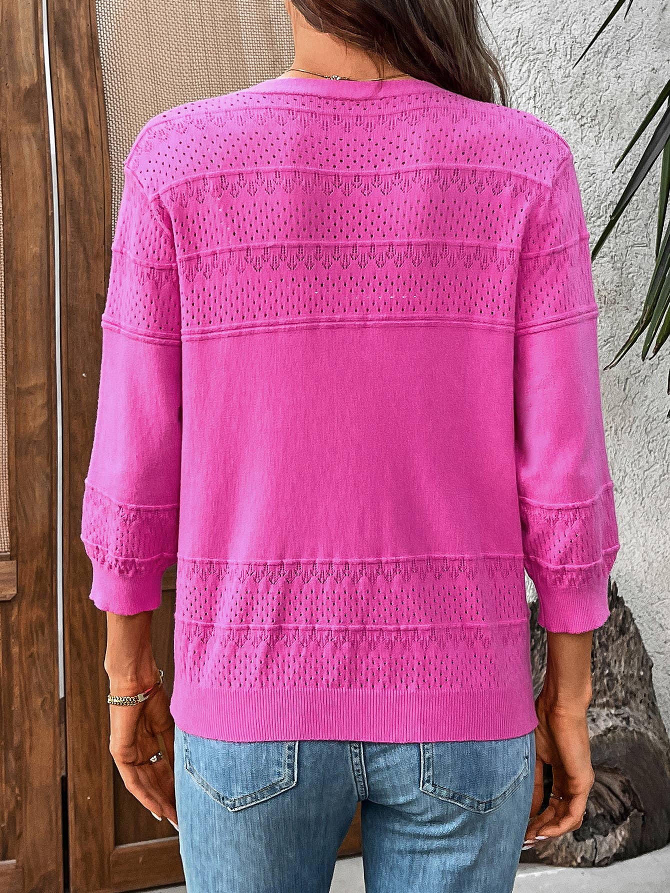 Three-quarter sleeve hollowed-out V-neck cardigan
