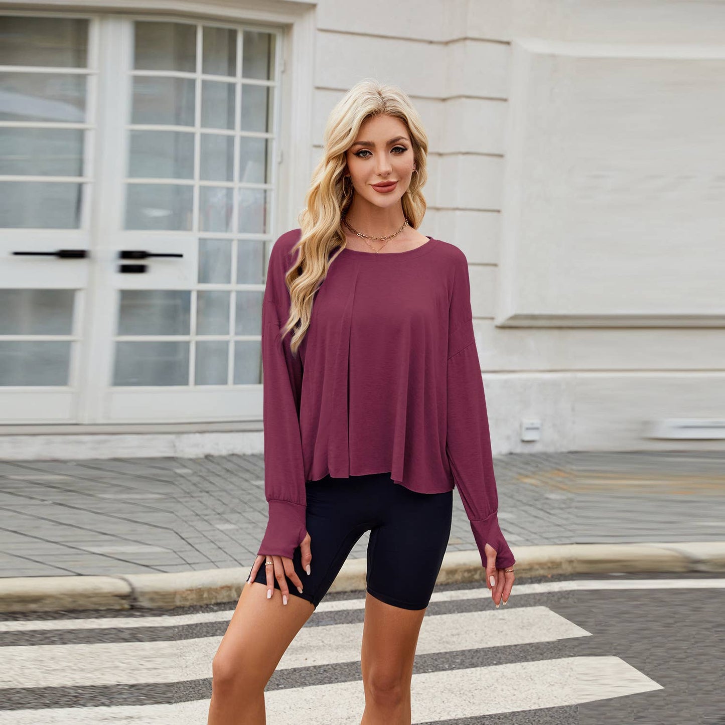 Long sleeve solid color loose back cut-out top