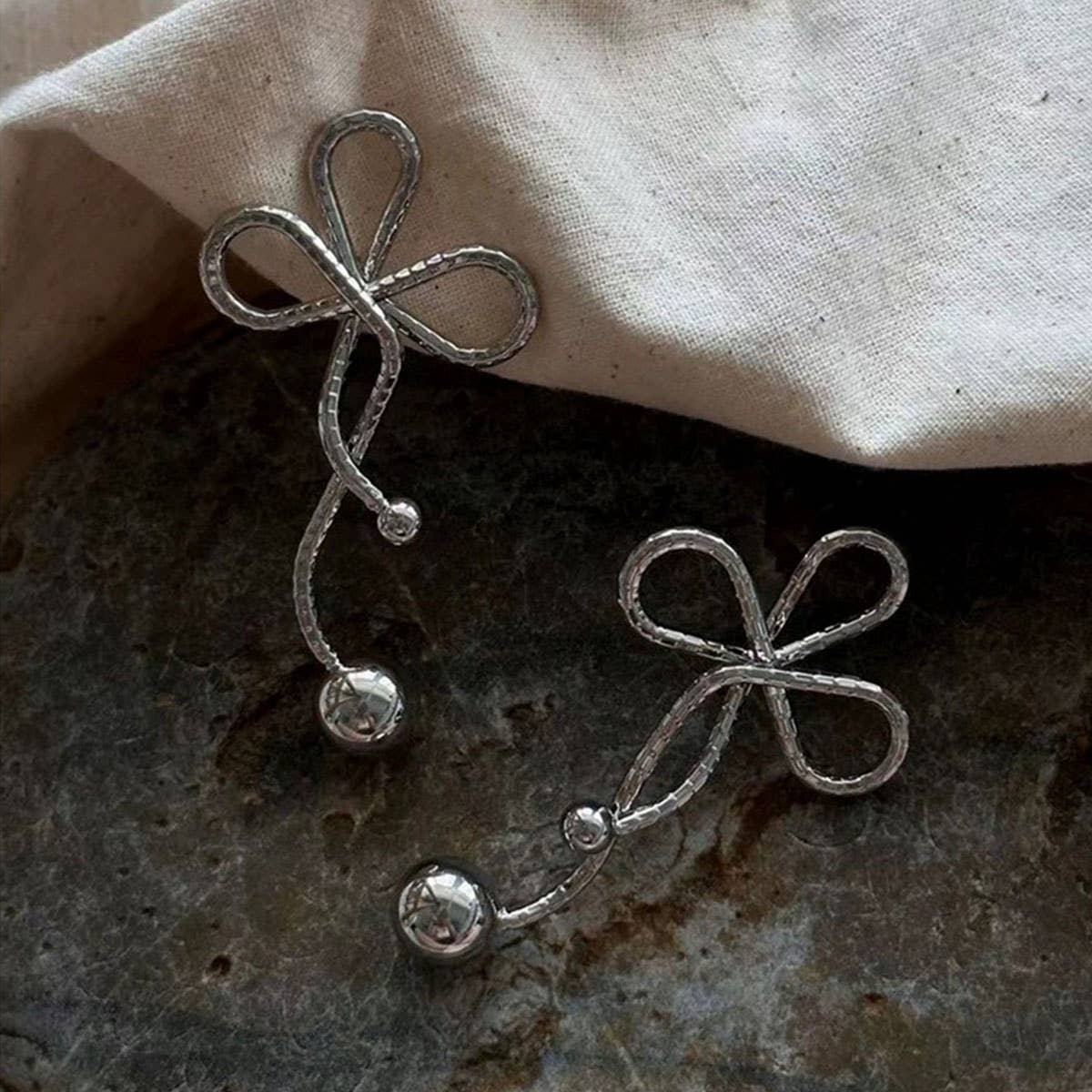 GEOMETRIC TWISTED FLOWER PEARL TASSEL BOW EARRINGS