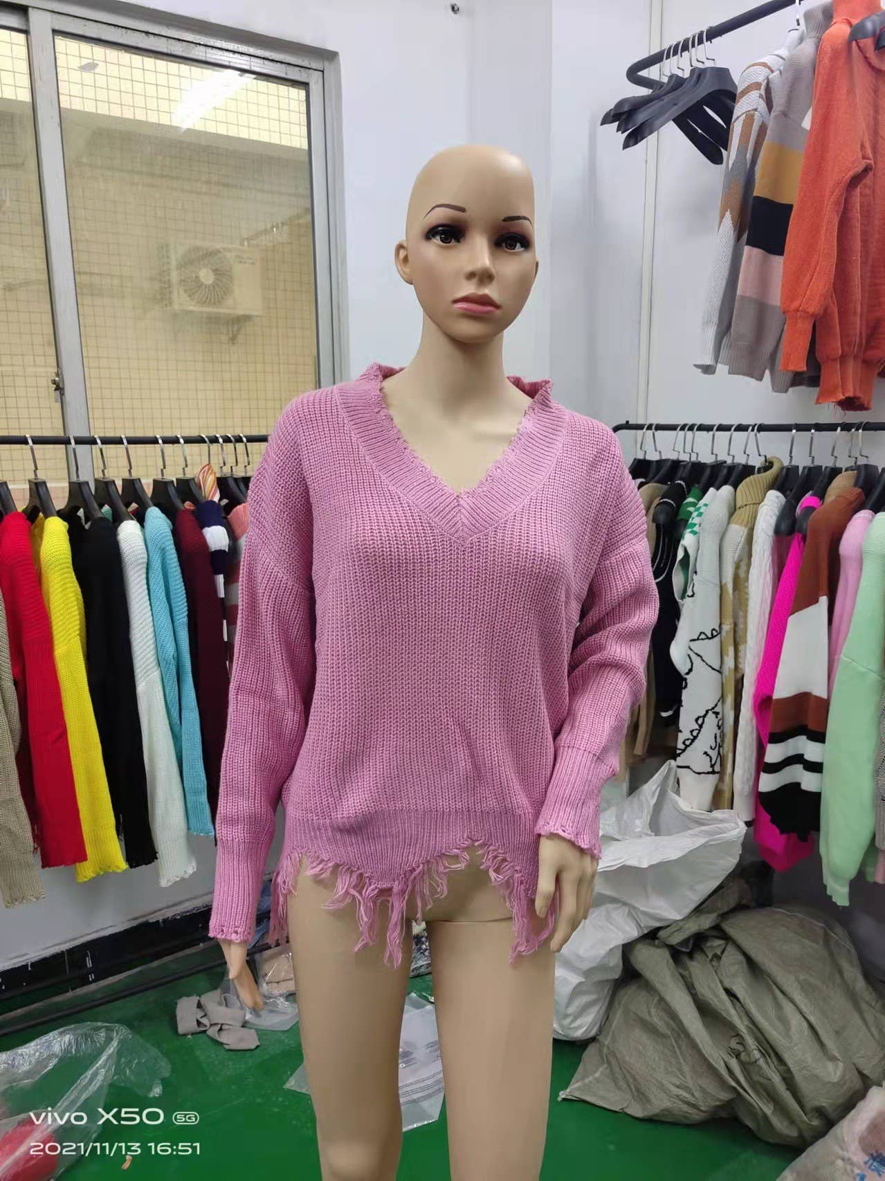 KNIT SWEATER WITH LARGE V-NECK FRINGE HEM